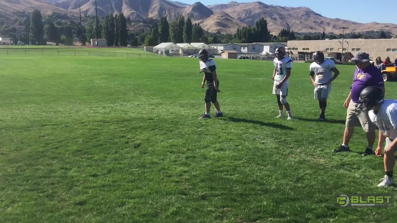 Keeping the head out of tackling with tracking drill. Eyes on near hip, contact with shoulder.