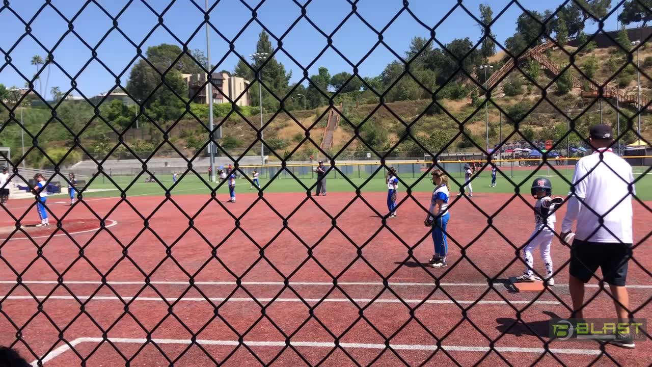 Olivia hits to get on second and get an RBI.